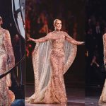 Celine Dion singing in a gold dress